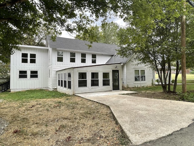 401 College St, Petersburg, TN 37144 - back of property featuring a patio, board and batten siding, and roof with shingles