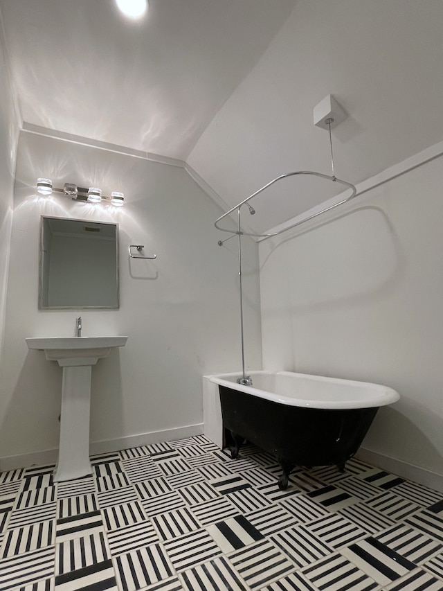 bathroom featuring vaulted ceiling and shower / bath combination