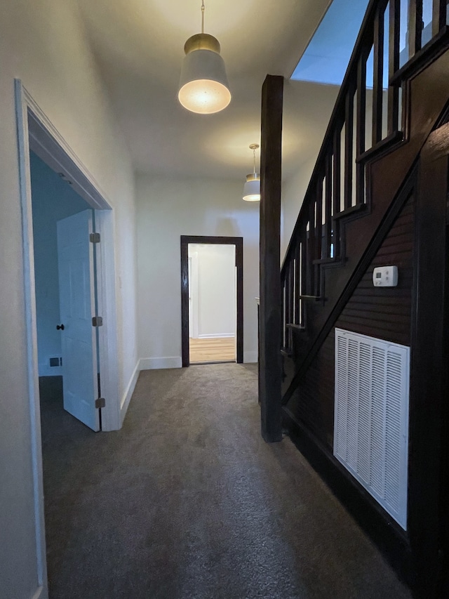 interior space with dark colored carpet