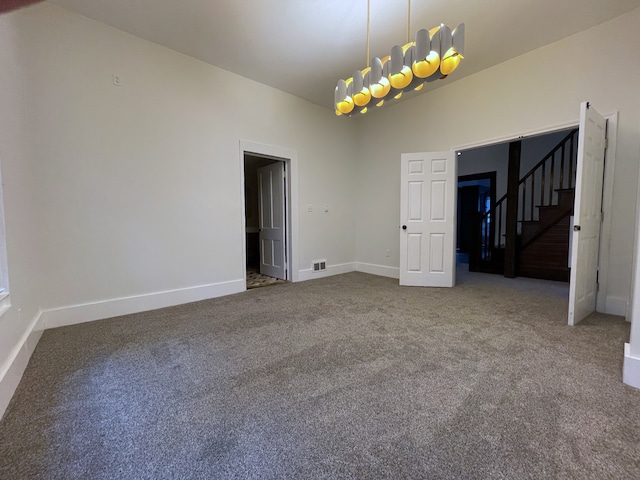 unfurnished dining area featuring carpet flooring