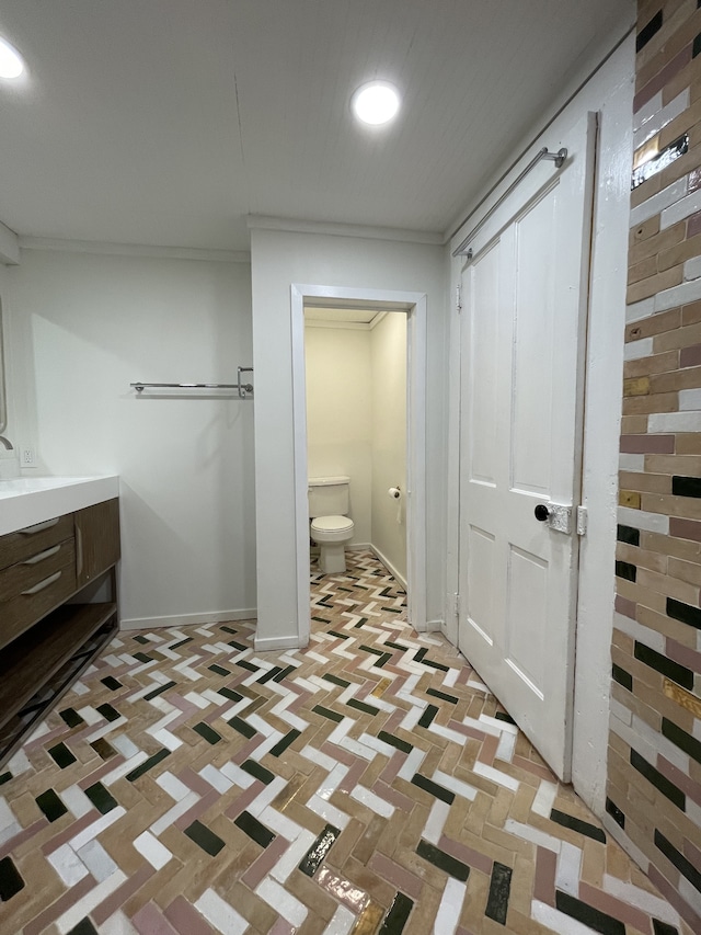 bathroom with vanity and toilet