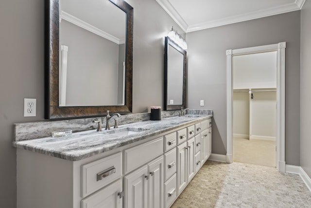 bathroom with ornamental molding and vanity