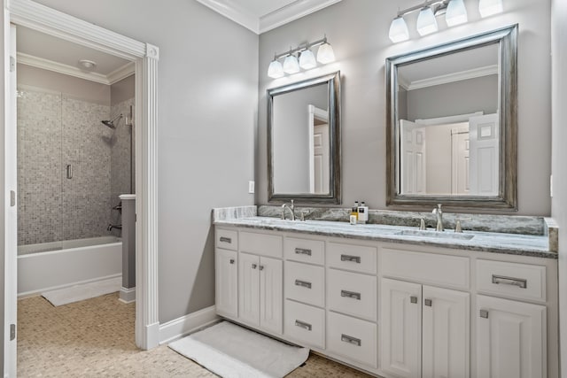 bathroom featuring tiled shower / bath combo, crown molding, and vanity