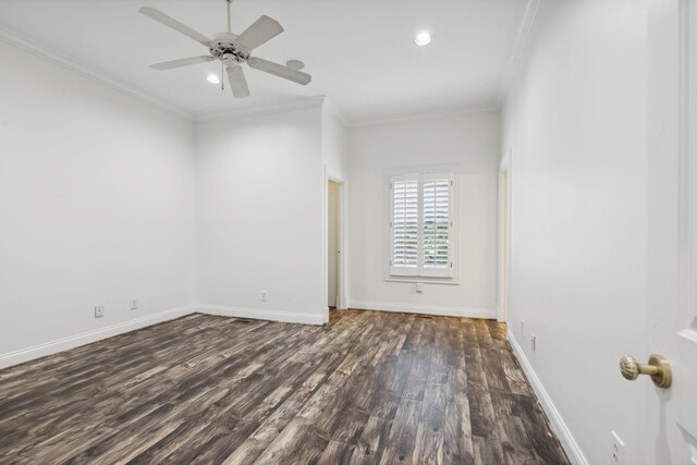 empty room with ceiling fan, ornamental molding, and dark hardwood / wood-style flooring