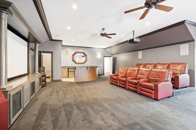 carpeted cinema room with crown molding and ceiling fan