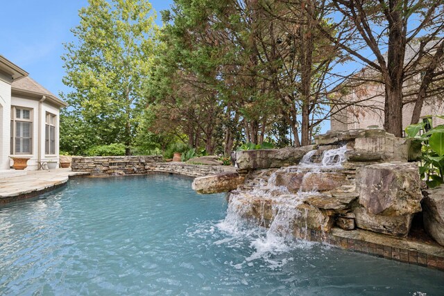 view of pool featuring pool water feature