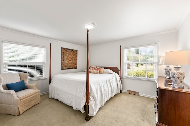 bedroom with light colored carpet and ornamental molding