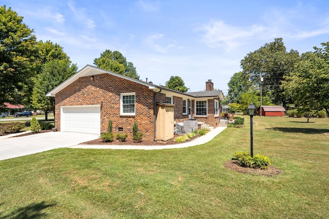 ranch-style home featuring a front yard and a garage