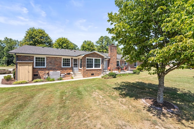 single story home featuring a front lawn and central AC