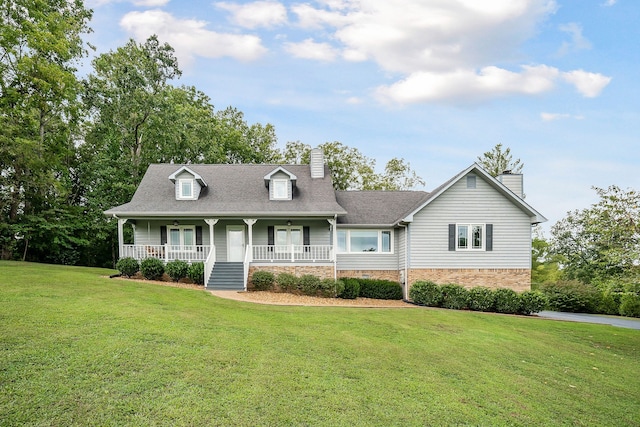 cape cod home featuring covered porch and a front lawn