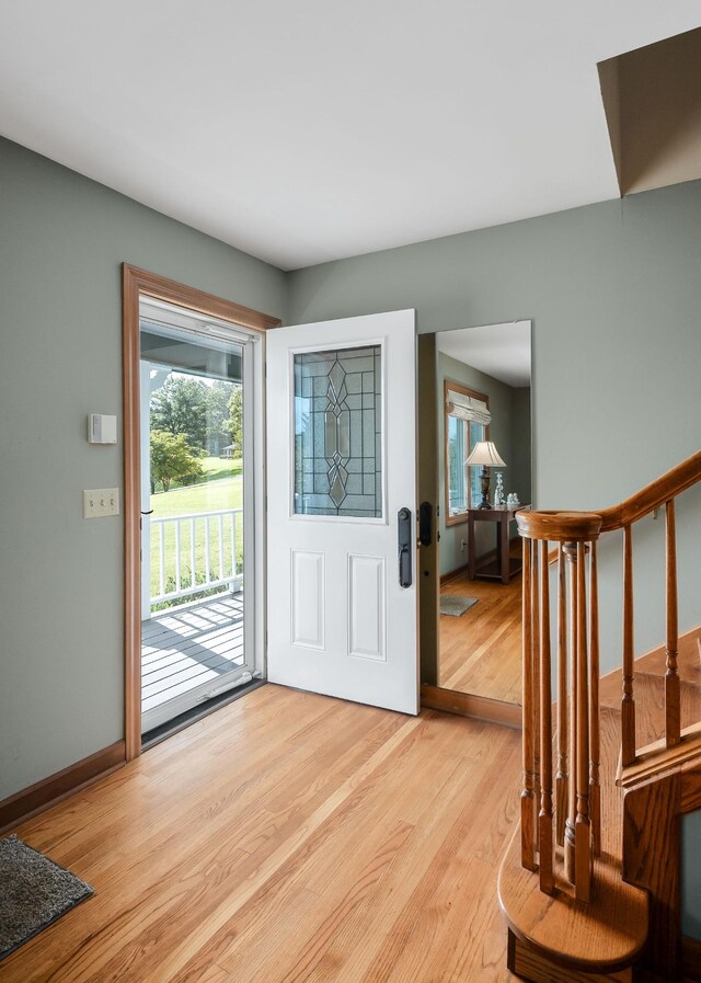 foyer entrance with light wood-type flooring