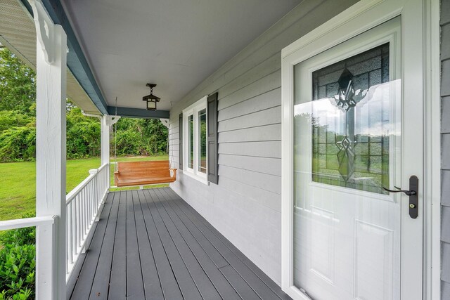 wooden terrace featuring a porch