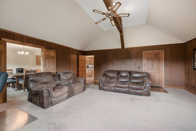 carpeted living room with ceiling fan with notable chandelier, lofted ceiling, and wooden walls