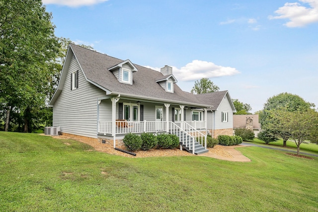 view of front of house with covered porch, central AC, and a front yard