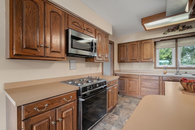 kitchen with black stove and sink