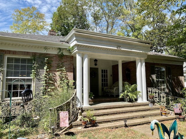 property entrance with covered porch