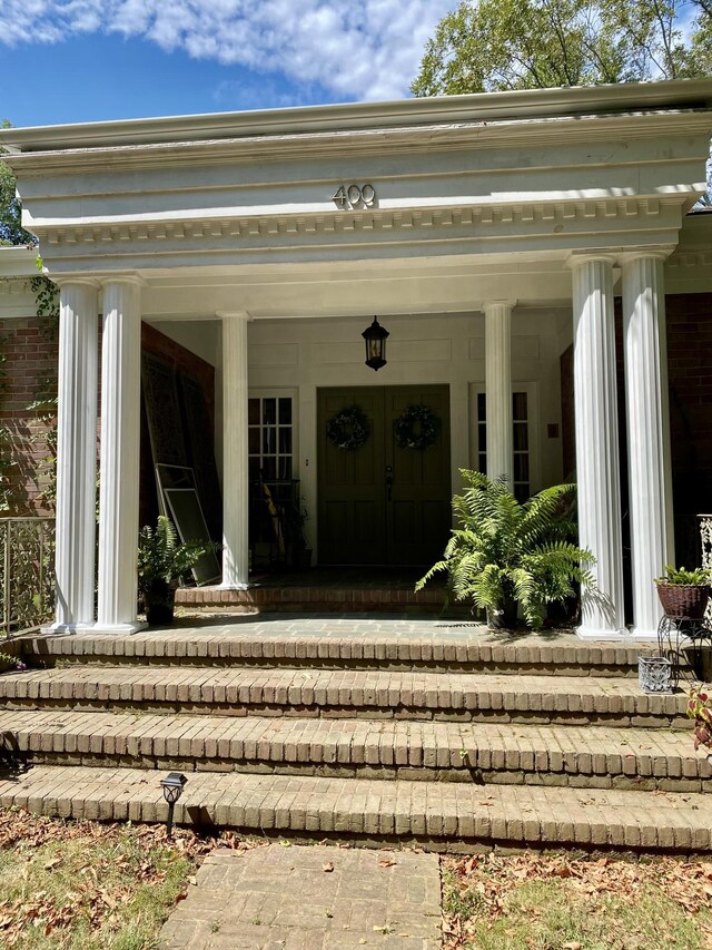 doorway to property featuring a porch