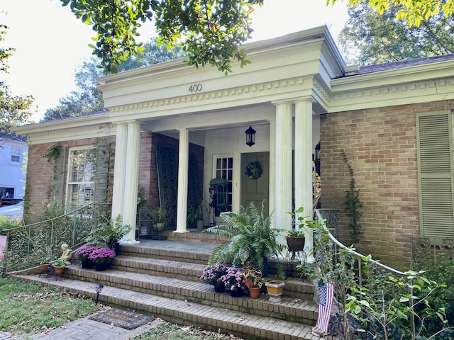 doorway to property featuring covered porch