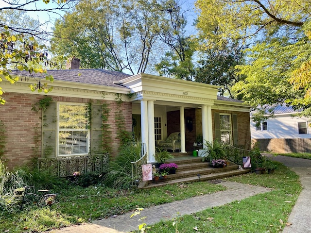 neoclassical / greek revival house featuring a porch