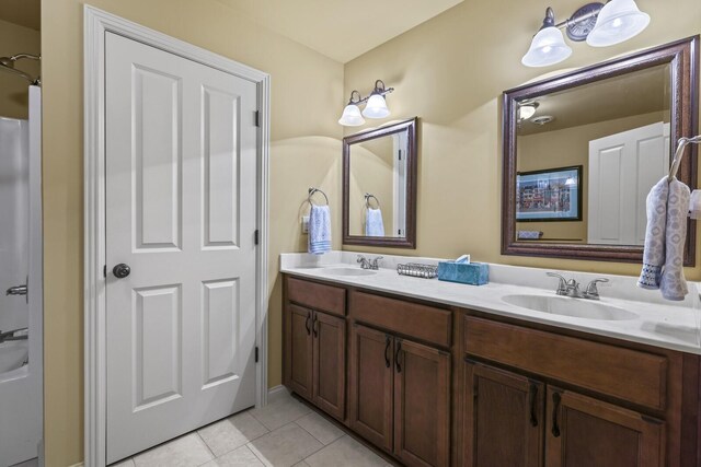 bathroom with tile patterned flooring and vanity