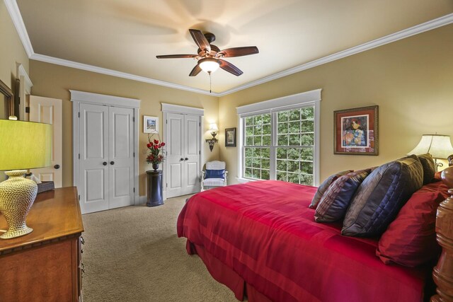 bedroom with ornamental molding, ceiling fan, and carpet flooring