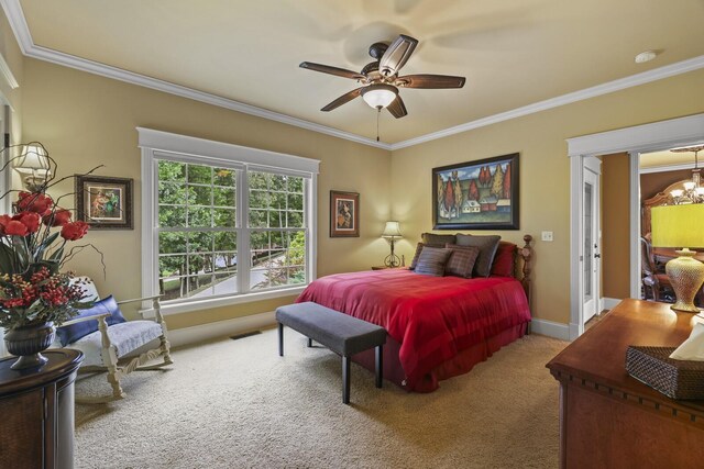 carpeted bedroom with ornamental molding and ceiling fan with notable chandelier