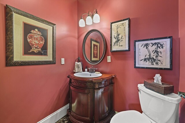 bathroom with toilet and vanity