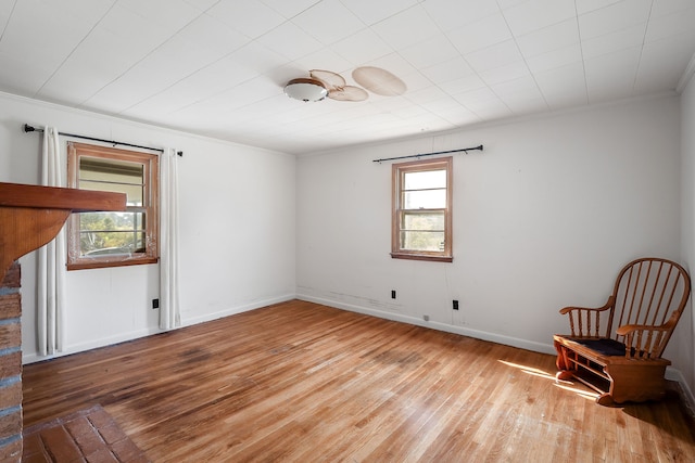 unfurnished room featuring crown molding and hardwood / wood-style floors