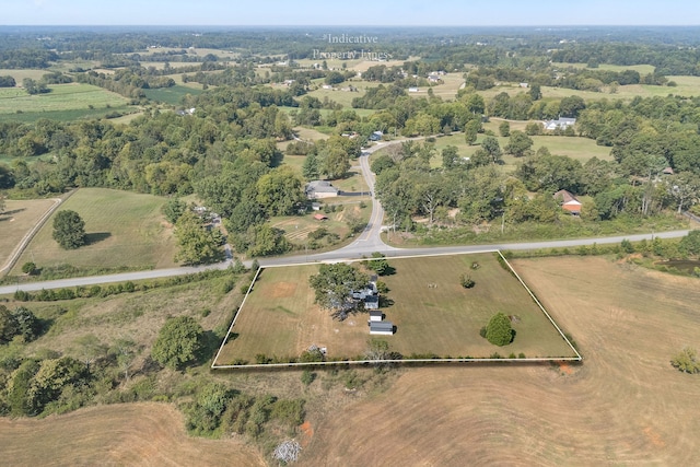 birds eye view of property with a rural view