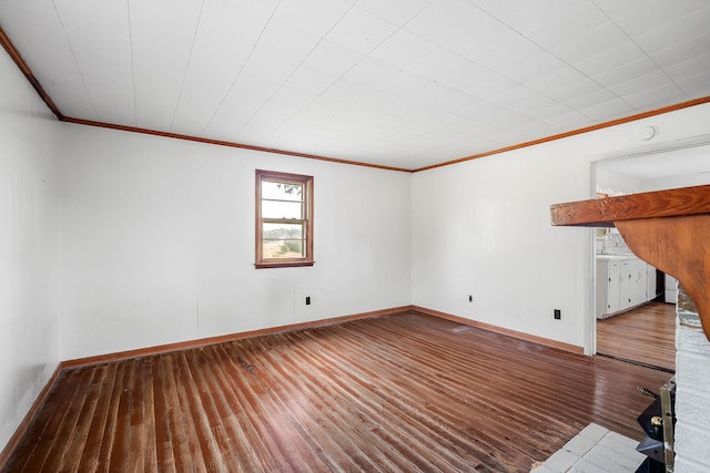 unfurnished room featuring hardwood / wood-style flooring and ornamental molding