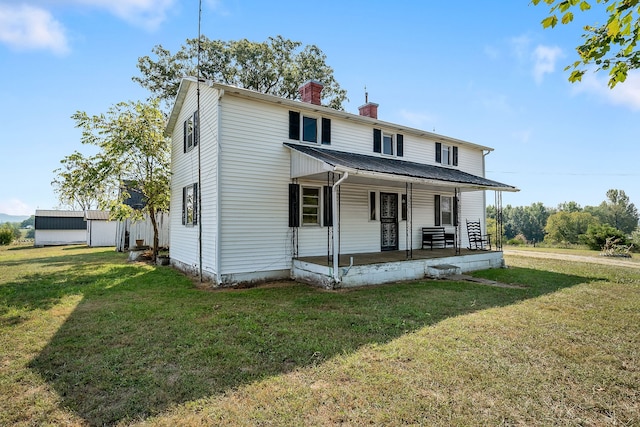 view of front of home with a front yard and a porch