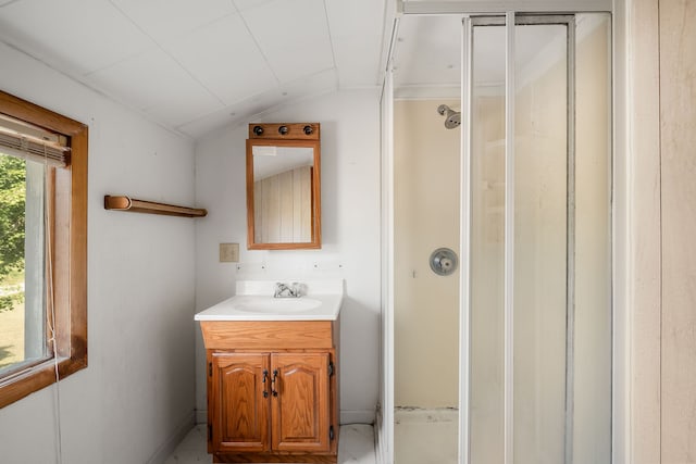 bathroom featuring vanity and vaulted ceiling