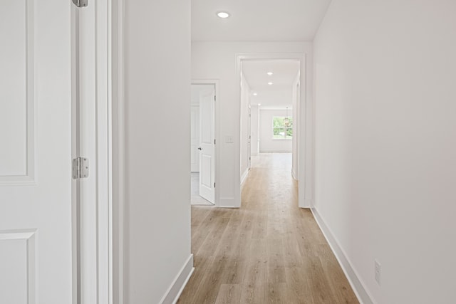 corridor featuring light hardwood / wood-style flooring