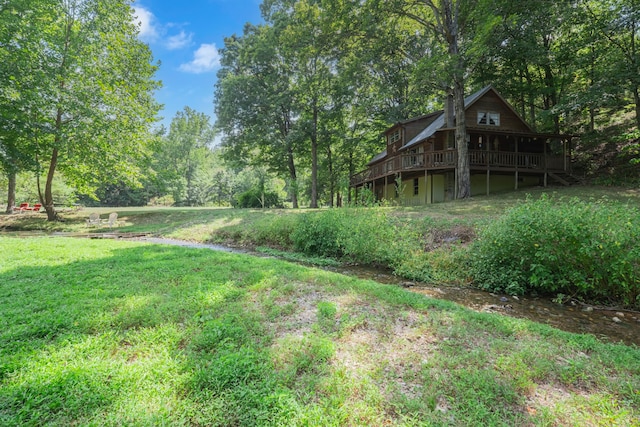 view of yard with a wooden deck