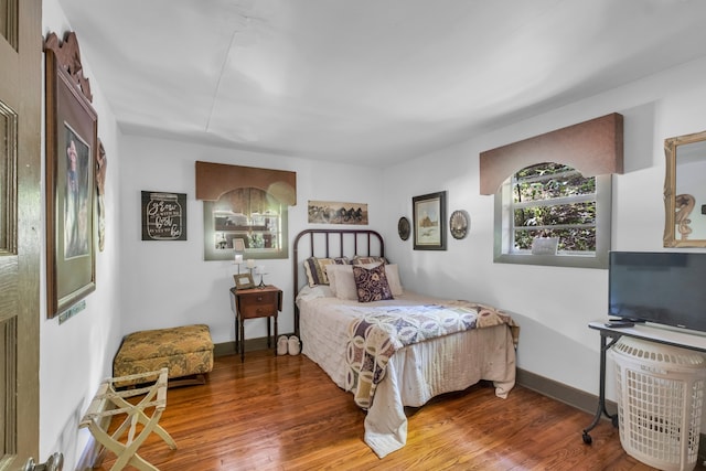 bedroom featuring wood-type flooring