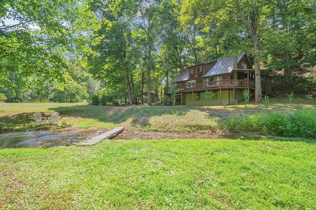 view of yard with a wooden deck