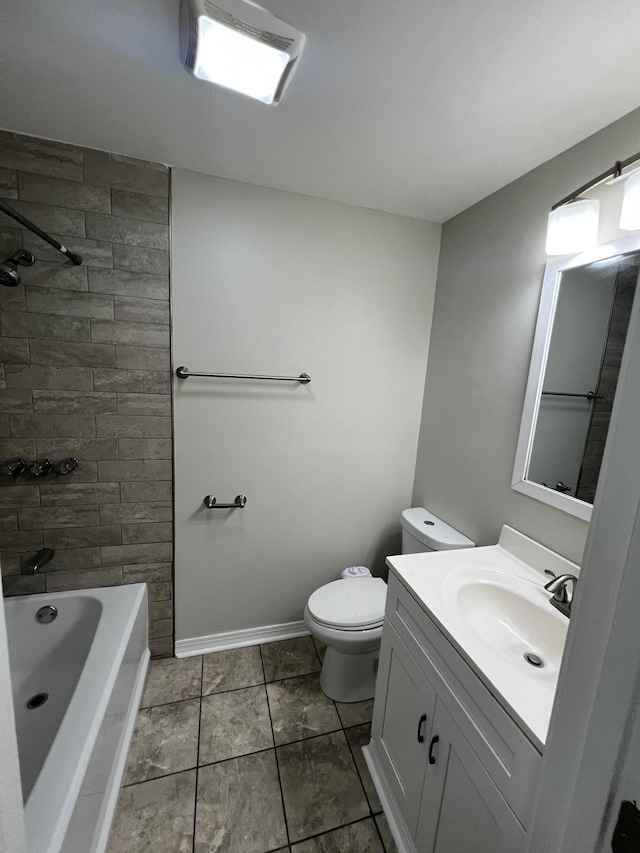 full bath with baseboards, vanity, and toilet