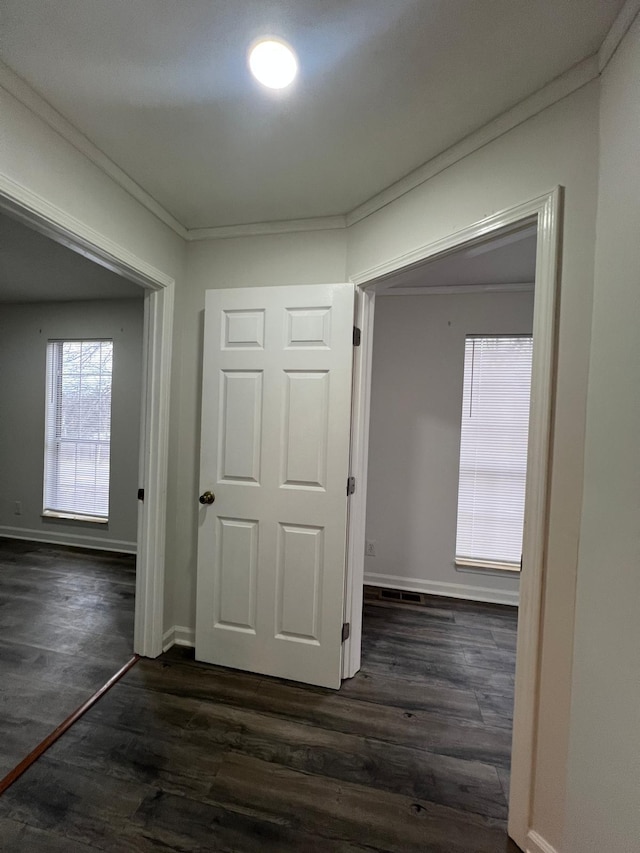 hall featuring dark wood finished floors and baseboards