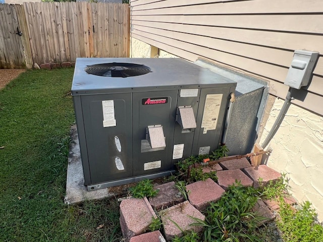 exterior details with fence and central AC unit