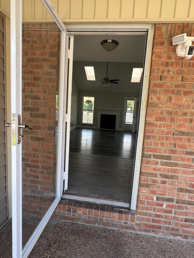 entrance to property with board and batten siding and brick siding