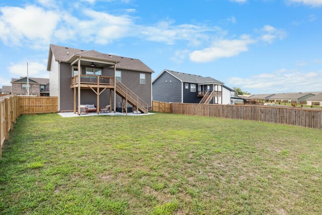 rear view of property with a lawn and a patio area