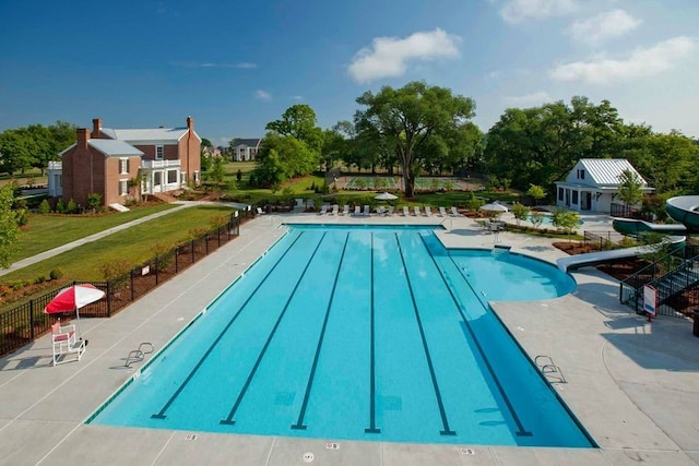 view of swimming pool with a patio area