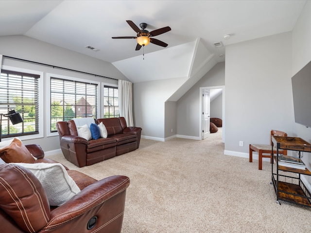 carpeted living room featuring ceiling fan and lofted ceiling