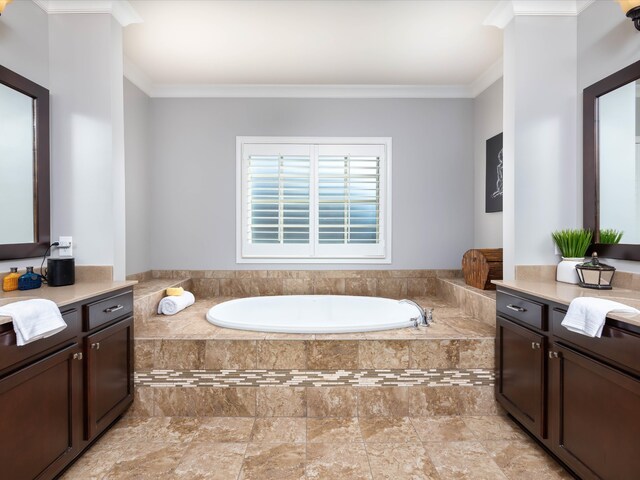 bathroom featuring a relaxing tiled tub, ornamental molding, and vanity