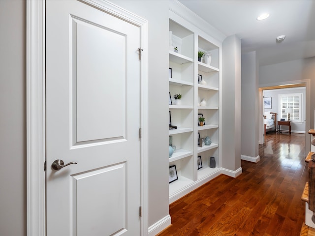 corridor featuring dark hardwood / wood-style floors