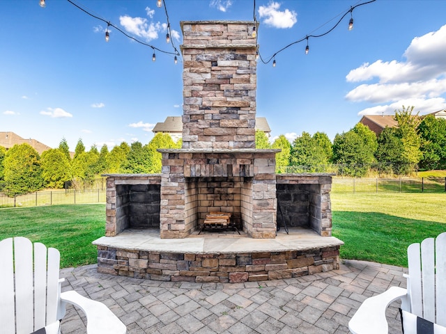 view of patio / terrace with an outdoor stone fireplace