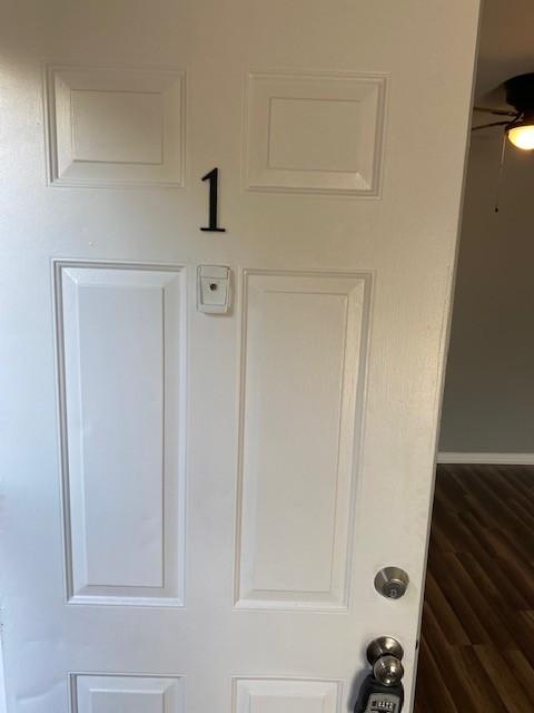 room details featuring wood-type flooring and ceiling fan