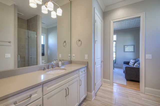 bathroom featuring walk in shower, plenty of natural light, wood-type flooring, and vanity