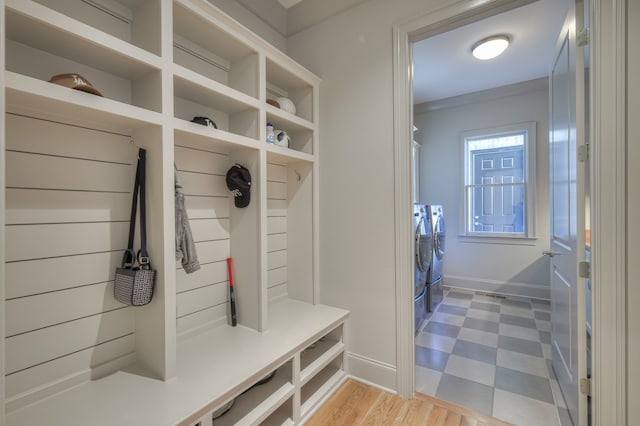 mudroom with light hardwood / wood-style flooring and ornamental molding