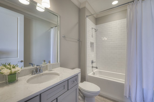 full bathroom with ornamental molding, vanity, toilet, and shower / bath combo